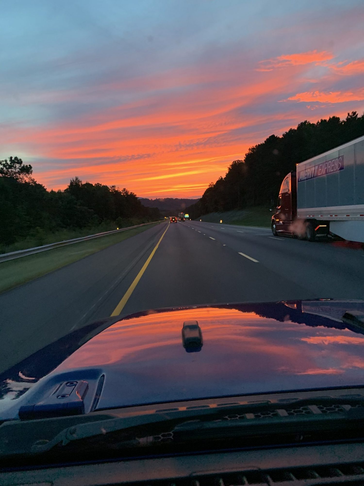 Sunset over the highway from the road