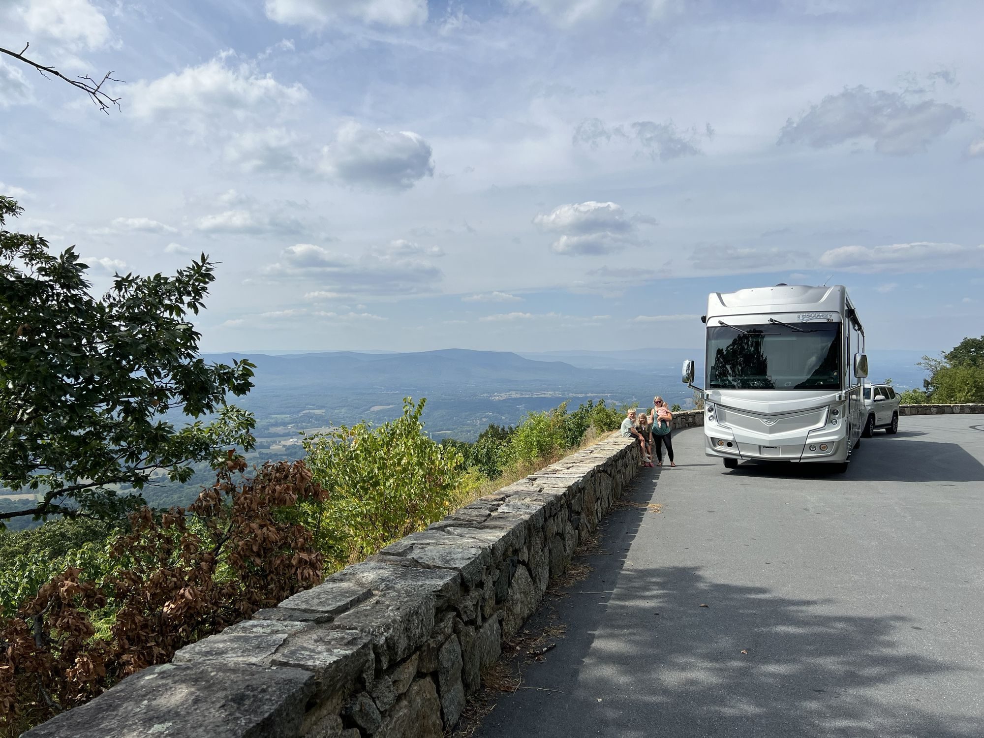 Our motorhome at a mountain overlook with the valley below
