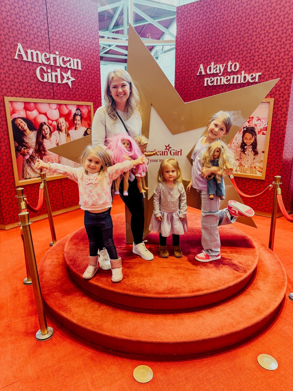 Samantha and her three girls on the star at American Girl Place