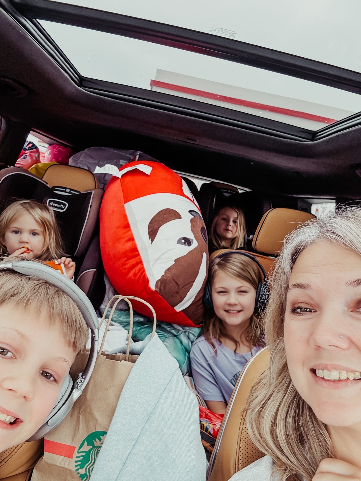 Samantha and her four children in a car packed to the roof