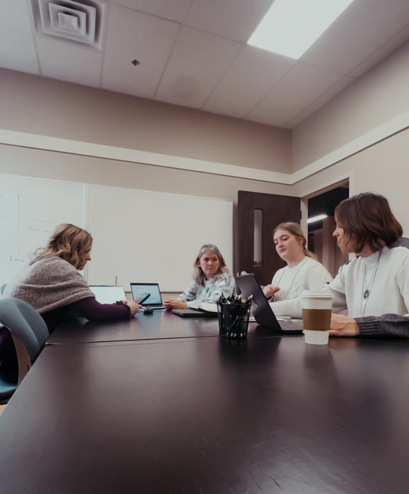 A client meeting around a conference table