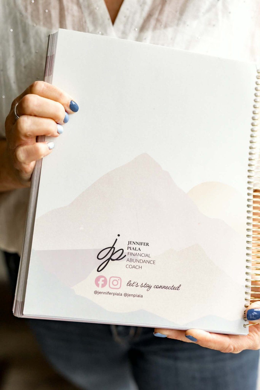 The back cover of the workbook with the jp mountain logo