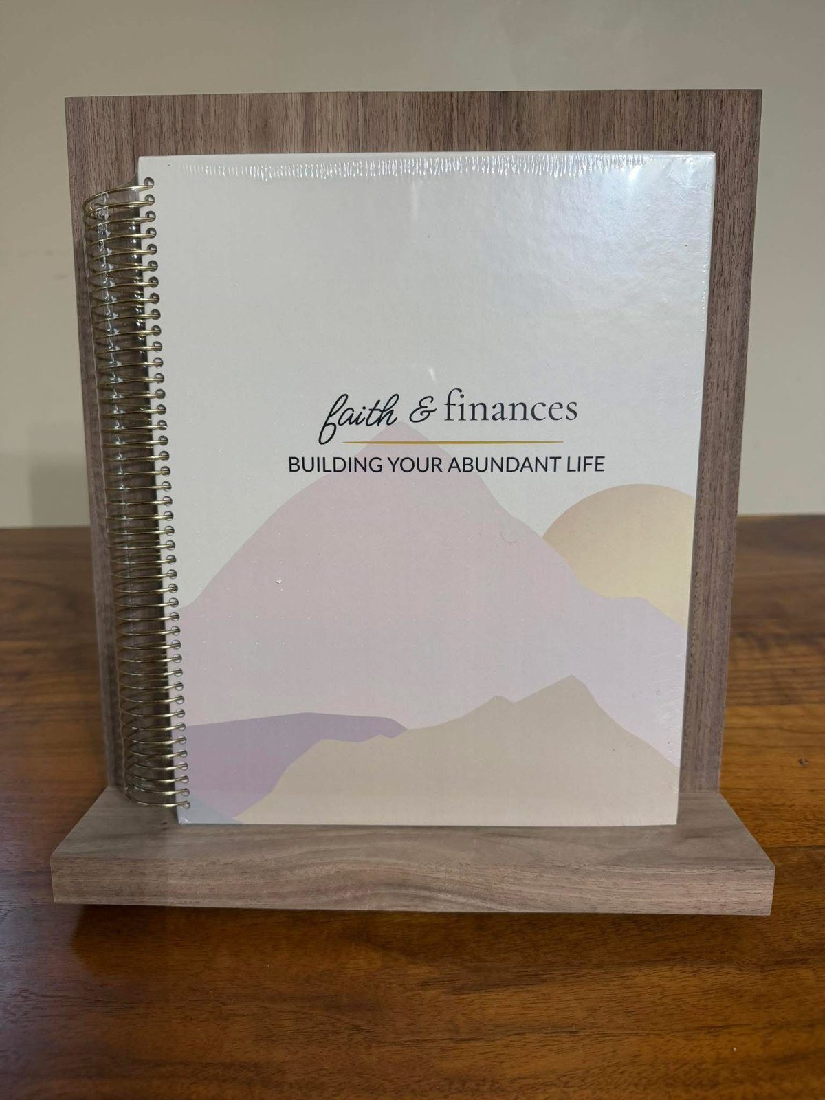The finished workbook on a stand Jennifer's husband custom built for her