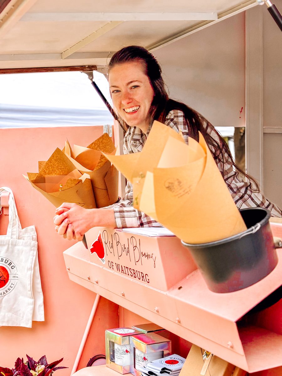 Cierra Schafer at the Red Bird Blooms market booth