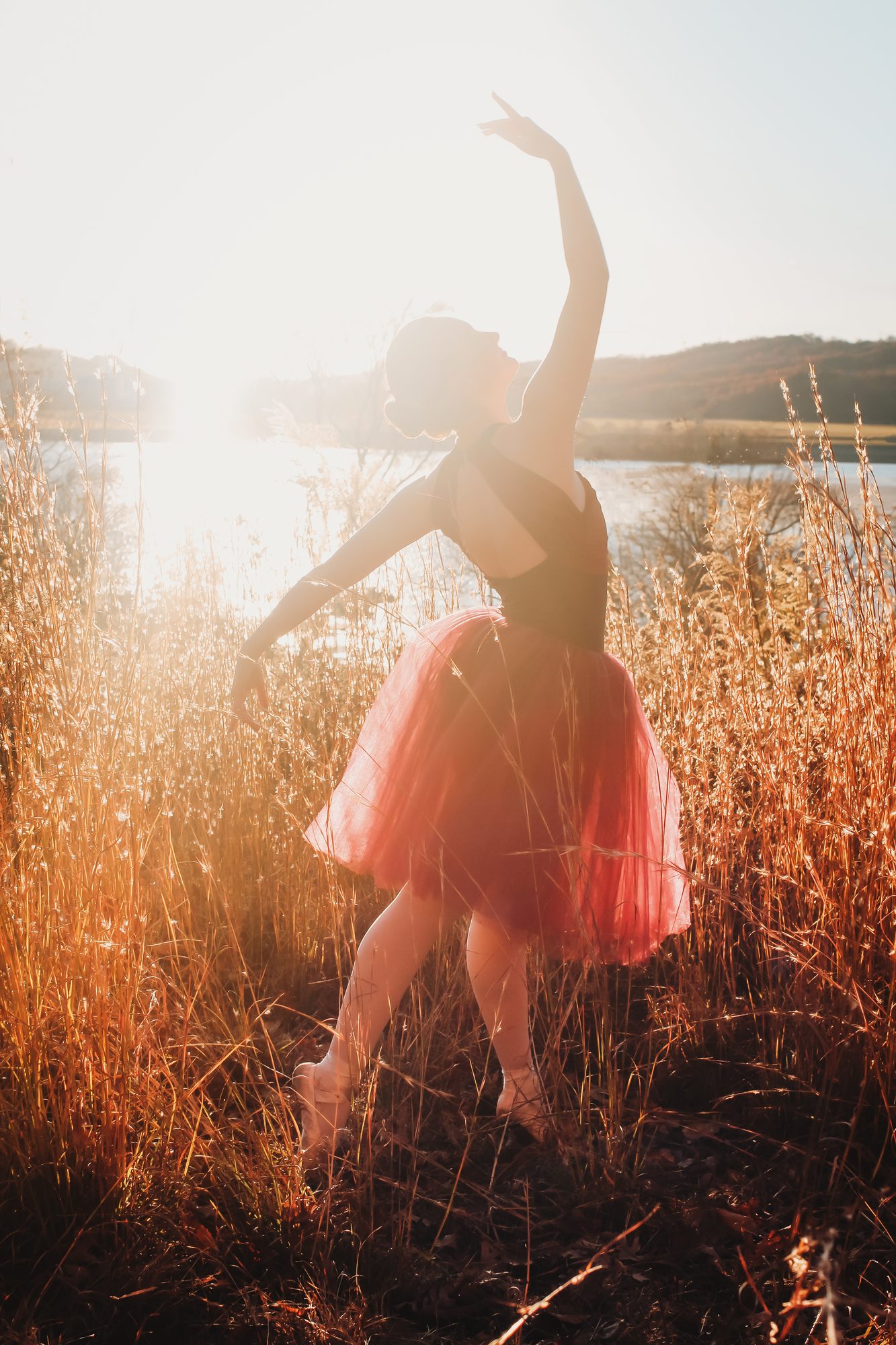 A dancer among the natural grasses at the low end of the property
