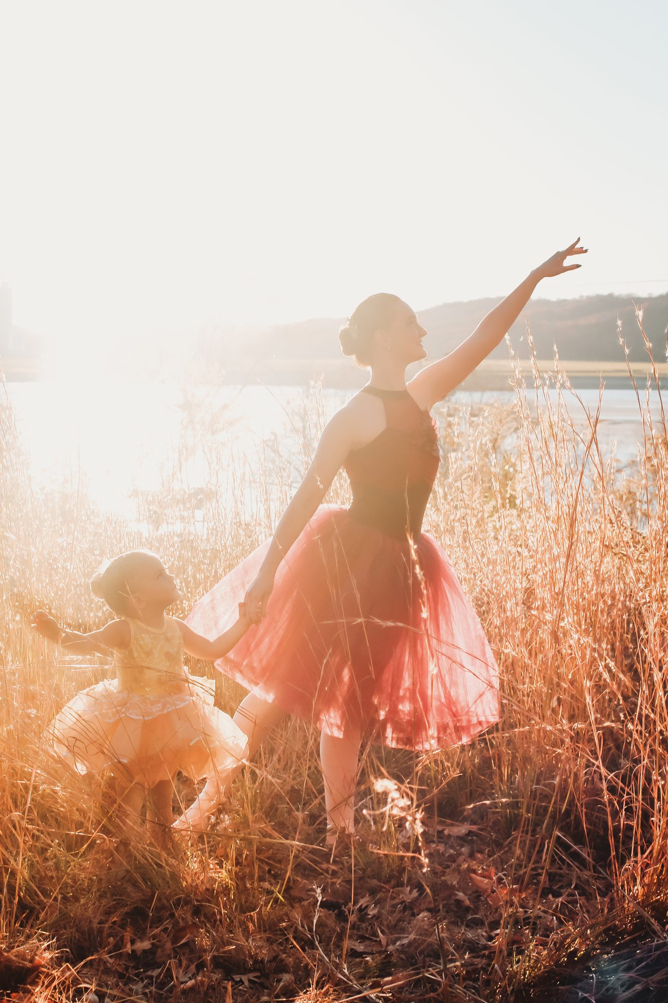 Dancer in red tutu silhouetted at golden hour